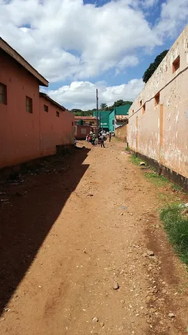 back street: a usually small and narrow street or alley, especially one in inferior or poorer parts of a city,...