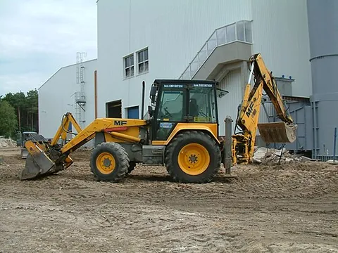 backhoe loader: a type of heavy equipment, a wheeled tractor unit with an excavator arm on the back and a payloader...
