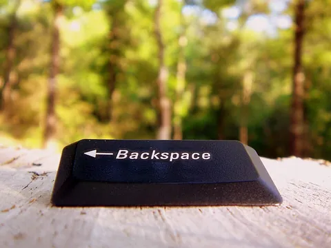 backspace: the key on a typewriter that moves the head one position backwards