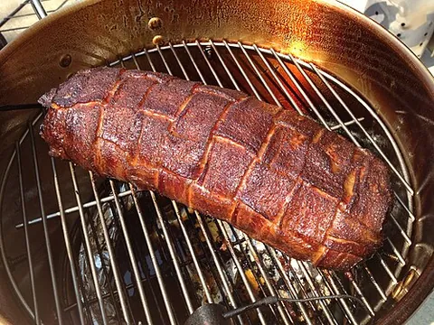 bacon explosion: a food made from bacon wrapped around a filling of spiced sausage and crumbled bacon, then smoked...