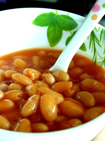 baked beans: a food consisting of beans baked or stewed in a usually tomato-based sauce