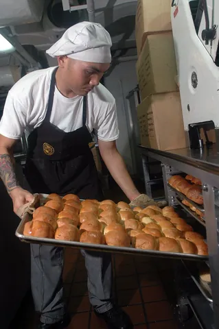 baking tray: an oven-proof metal tray used to hold foods in the oven