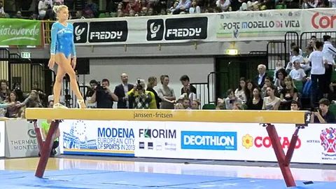 balance beam: a gymnastics apparatus, a narrow wooden rail used in artistic (athletic) gymnastics