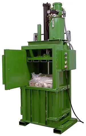 baler: a machine for creating bales, e.g., of hay or cotton