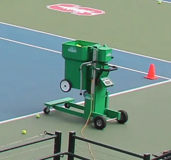 ball machine: a machine that shoots tennis balls out of a pipe, allowing a player to practise hitting them