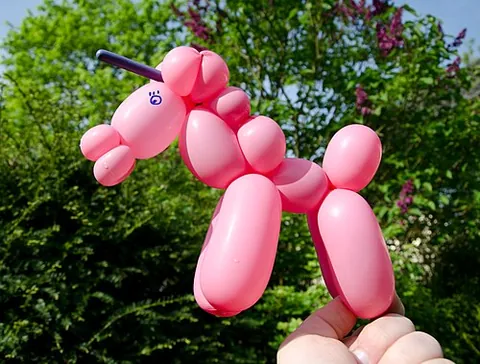 balloon animal: a representation of an animal, made of a number of balloons twisted, shaped and connected