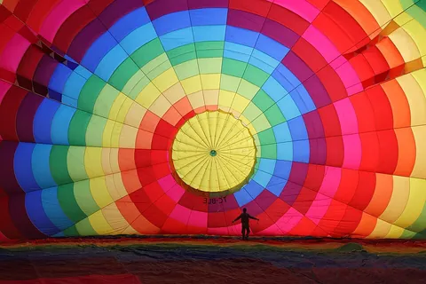 balloon: an inflatable buoyant object, often (but not necessarily) round and flexible
