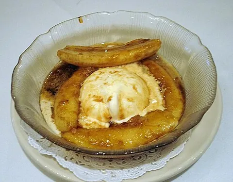 bananas foster: a dessert made of sliced bananas which are sautéed in rum, brown sugar, and banana liqueur. Served...
