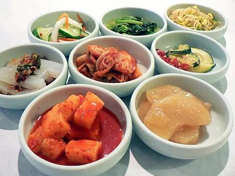 banchan: a small dish of food served with cooked rice in Korean cuisine