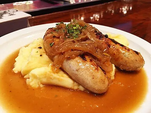 bangers and mash: a meal of sausages and mashed potato, usually with onions and gravy added