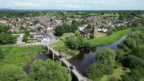 bangor-on-dee: a village and community in Wrexham borough county borough, Wales, historically in a detached part...