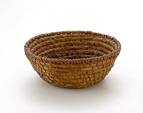 banneton: a type of basket used to provide structure for breads during proofing