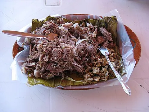 barbacoa: meat slow-cooked over an open fire, characteristic of Latin American cuisine