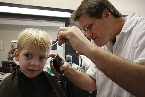 barbershop: the place of business of a barber; a store where a person (usually a male) can go to get a haircut