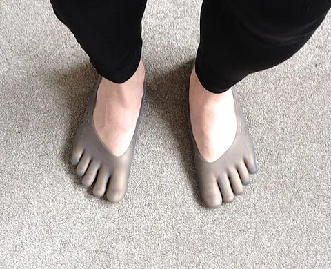 barefoot shoe: a minimal shoe that approximates the feeling of being barefoot while still protecting the sole