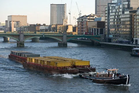 barge: a large flat-bottomed towed or self-propelled boat used mainly for river and canal transport of...