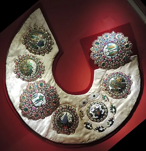 barma: a regal Russian mantle or neckpiece made of gold, encrusted with diamonds and other gems