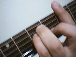 barre chord: a guitar chord played by pressing down multiple strings on the fretboard with the same finger
