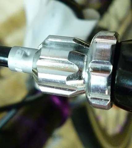 barrel adjuster: a cylindrical component that allows to fine-tune the cable tension of the brake or drivetrain,...
