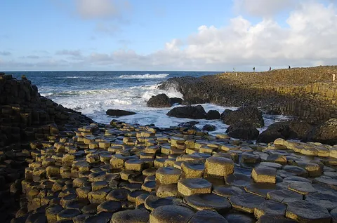 basalt: a hard mafic igneous rock of varied mineral content; volcanic in origin, which makes up much of the...