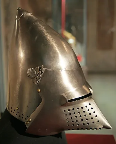 bascinet: a light helmet, typically with a high, pointed skull, either open-faced (in early models) or made...