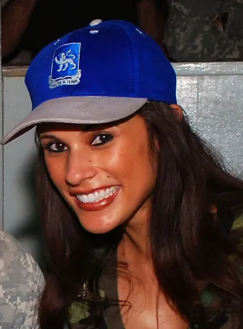 baseball cap: a cap with a rounded crown and a curved, stiffened bill at the front