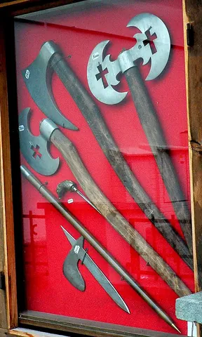 battle axe: an ancient military weapon, an axe designed for combat, including (in heraldry) when borne on arms...