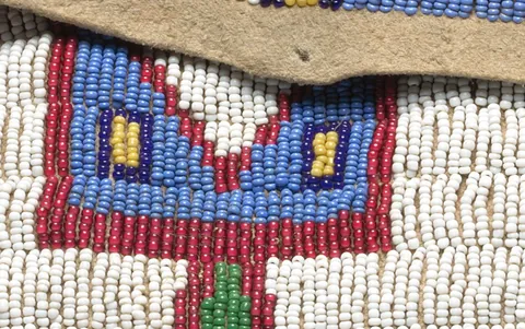beadwork: decorative work involving beads