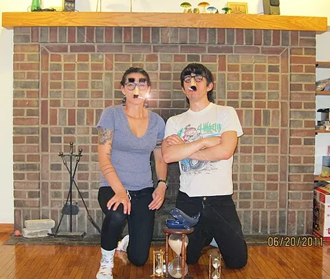 beaglepuss: a novelty pair of horn-rimmed glasses with attached eyebrows, plastic nose, and bushy mustache,...