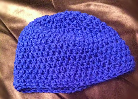 beanie: a cap that fits the head closely, usually knitted from wool