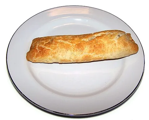 bedfordshire clanger: a dish originating from the English county of Bedfordshire, an elongated suet pudding with meat in...