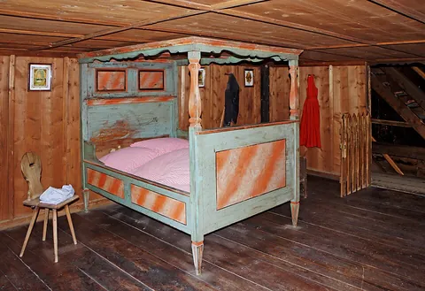 bedroom: a room in a house, apartment, hotel, or other dwelling where a bed is kept for sleeping
