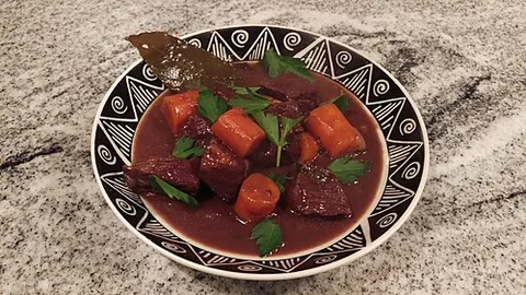 beef bourguignon: a French stew dish, consisting of beef, red wine, garlic and vegetables