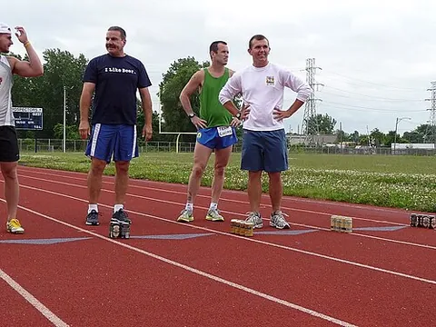 beer mile: a race in which competitors run four laps around a 1/4-mile track, and must drink a 12 fl oz (355...