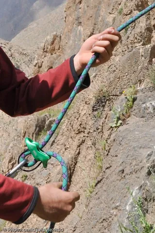 belay: to make (a rope) fast by turning it around a fastening point such as a cleat