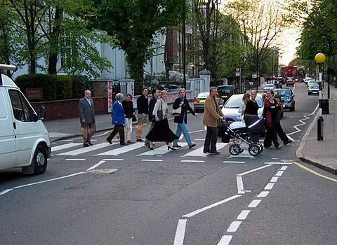 belisha beacon: a tall black and white pole topped by a flashing orange globe, placed on either side of the road at...