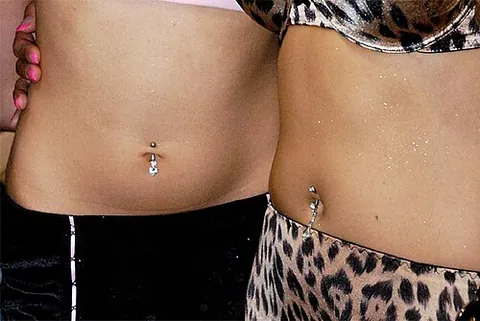 belly button ring: a form of body art wherein a piercing is placed in a cauterized puncture of the umbilicus