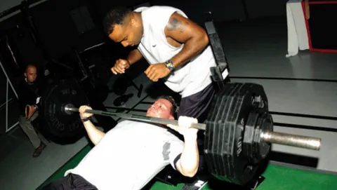 bench press: an exercise performed by pressing the weight of a barbell away from one's body while lying on a...