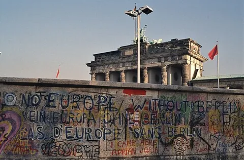 berlin wall: a wall that parted the city of Berlin until 1989, constructed by the German Democratic Republic to...