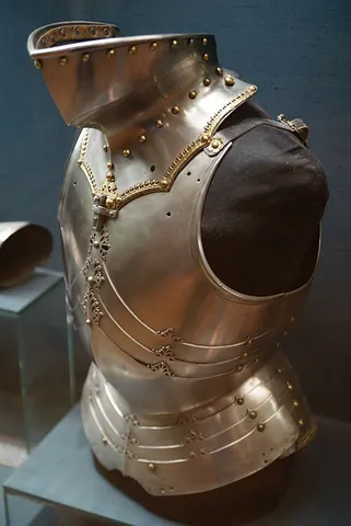 bevor: a portion of plate armour to protect the lower face and the neck, typically in two parts, called...