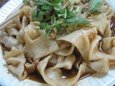 biangbiang noodles: a type of thick noodle from China's Shaanxi province, said to be named for the sound a noodle makes...