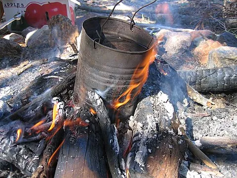 billycan: a lightweight pot for cooking or boiling water, used in camping
