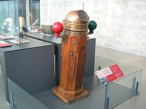binnacle: the wooden housing for a ship's compass, with its corrector magnets and illuminating arrangements