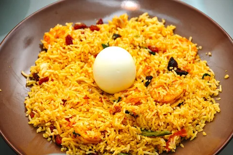 biryani: a spiced dish of rice, blended with meat and/or vegetables