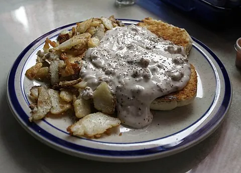 biscuits and gravy: a breakfast dish composed of soft dough biscuits covered in sawmill gravy, sometimes with pieces of...