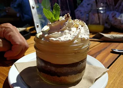 black bottom pie: an American dessert pie with meringue, custard, and a bottom layer of chocolate cream