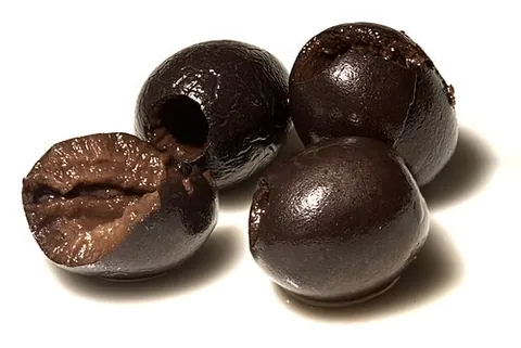 black olive: an olive picked after it has ripened; as opposed to a green olive which is picked before ripening