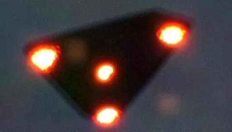 black triangle: one of a class of triangle-shaped unidentified flying objects, usually with a light in each corner