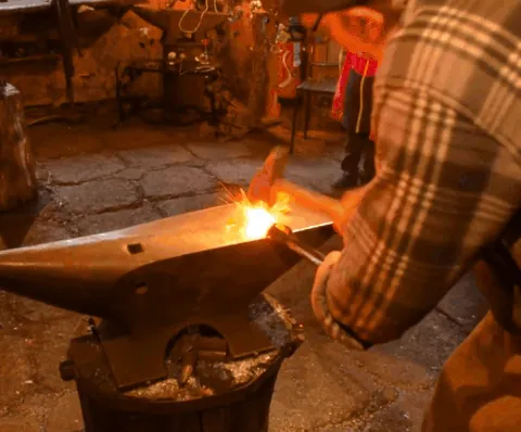 blacksmith: a person who forges iron