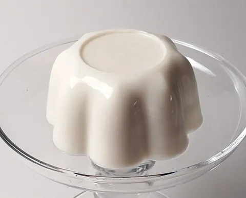 blancmange: a simple dessert made by cooking sweetened milk with cornstarch and vanilla